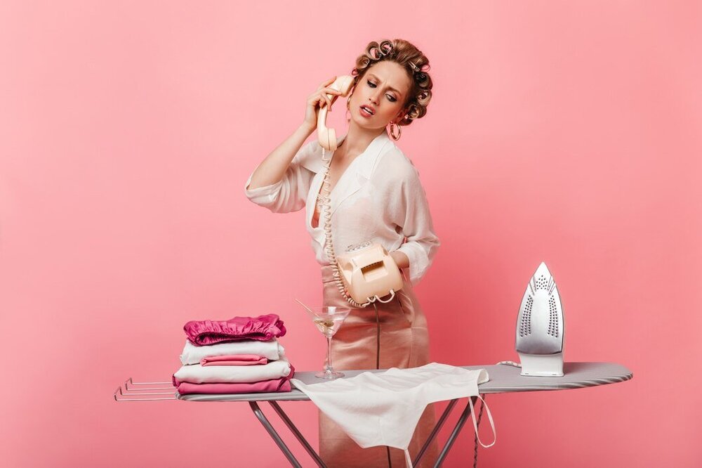 beautiful-woman-silk-outfit-looking-clothes-ironing-board-talking-phone_197531-18332.jpg